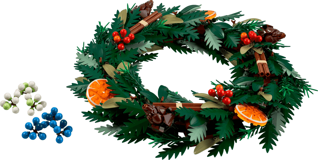 LEGO 10340 Wreath built, showing fir foliage, pine cones, cinnamon sticks, orange slices and the spare blue and white berries