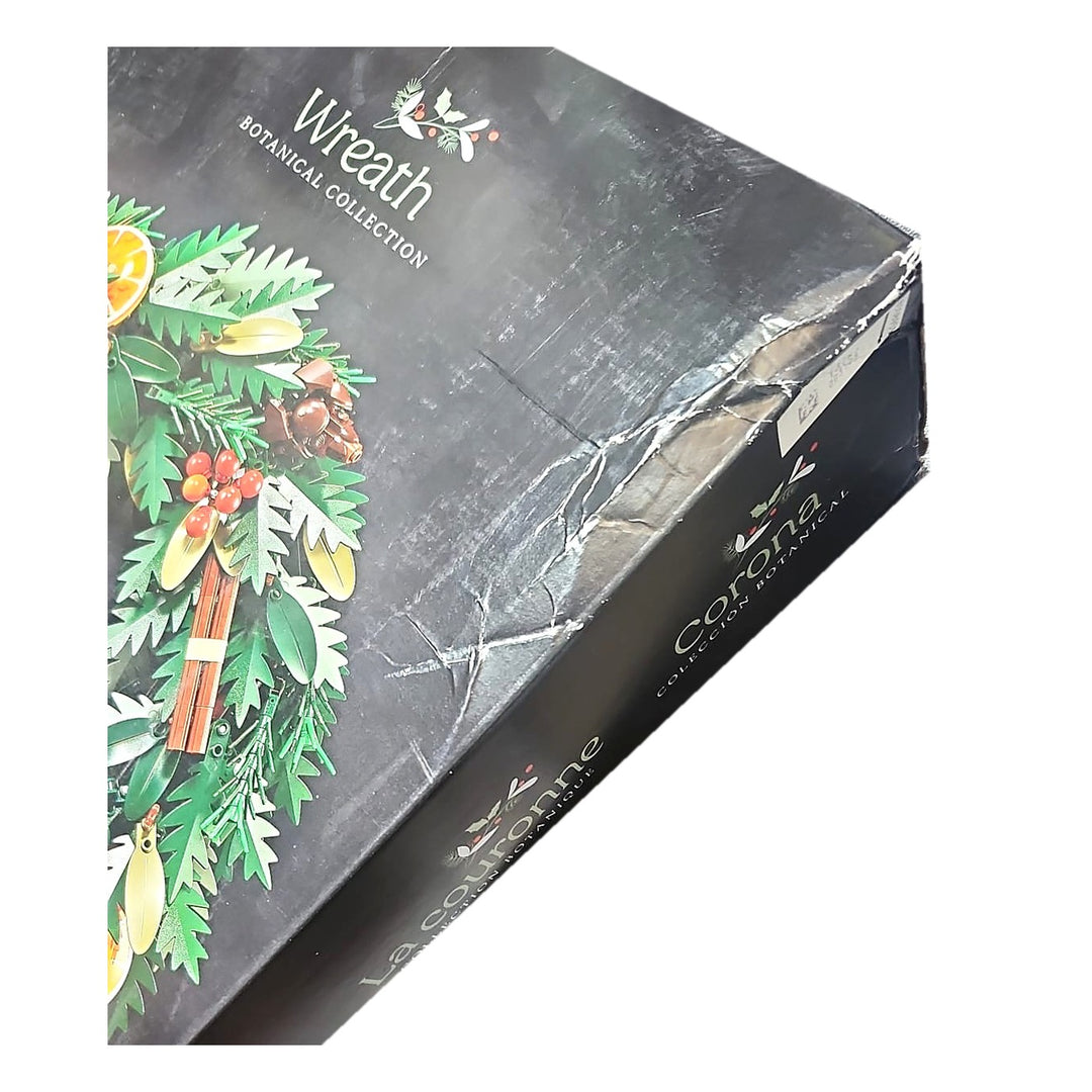 Actual box of this LEGO 10340 Wreath showing the crushed top corner and creasing across the lid, set is factory sealed
